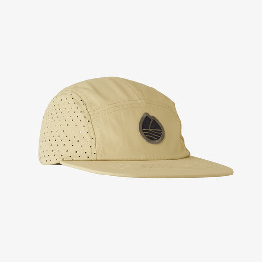 A beige Icon Swift hat with perforated holes on the side and a logo on the front.